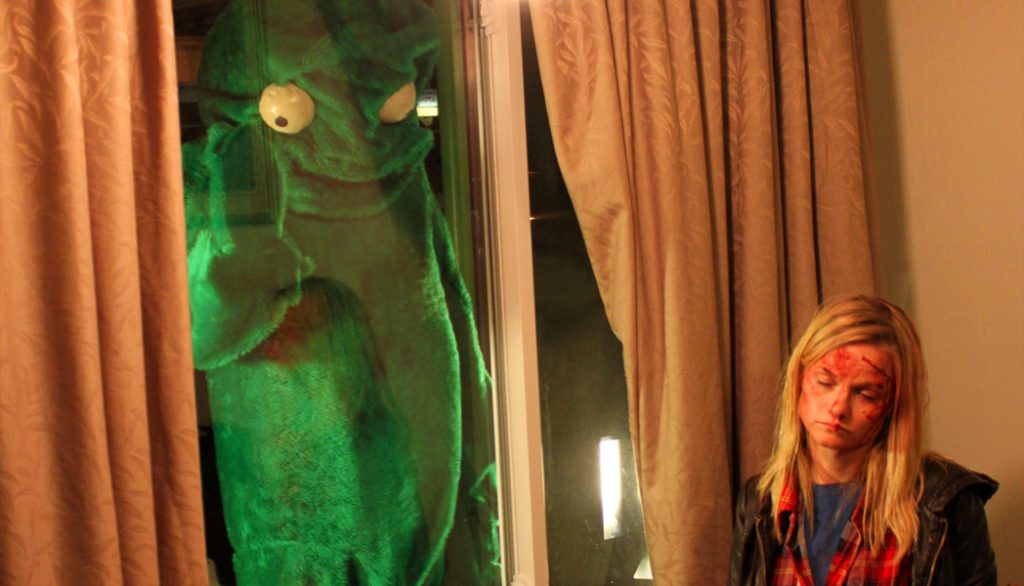 Lindsay Pulsipher and some ghoulish green giant star in Calvin Lee Reeder's The Oregonian (2011)